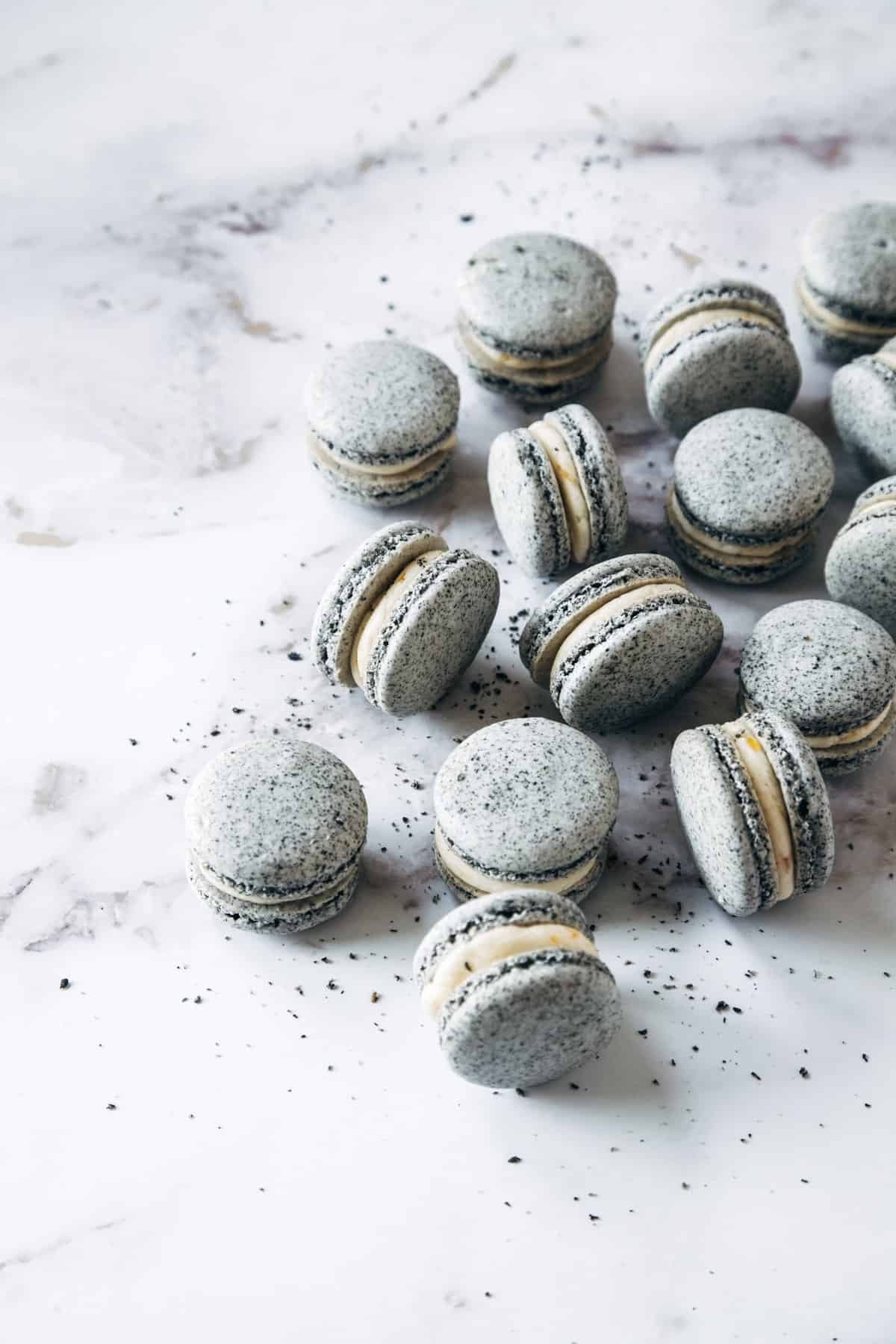 Assembled Black Sesame & Apricot Macarons.