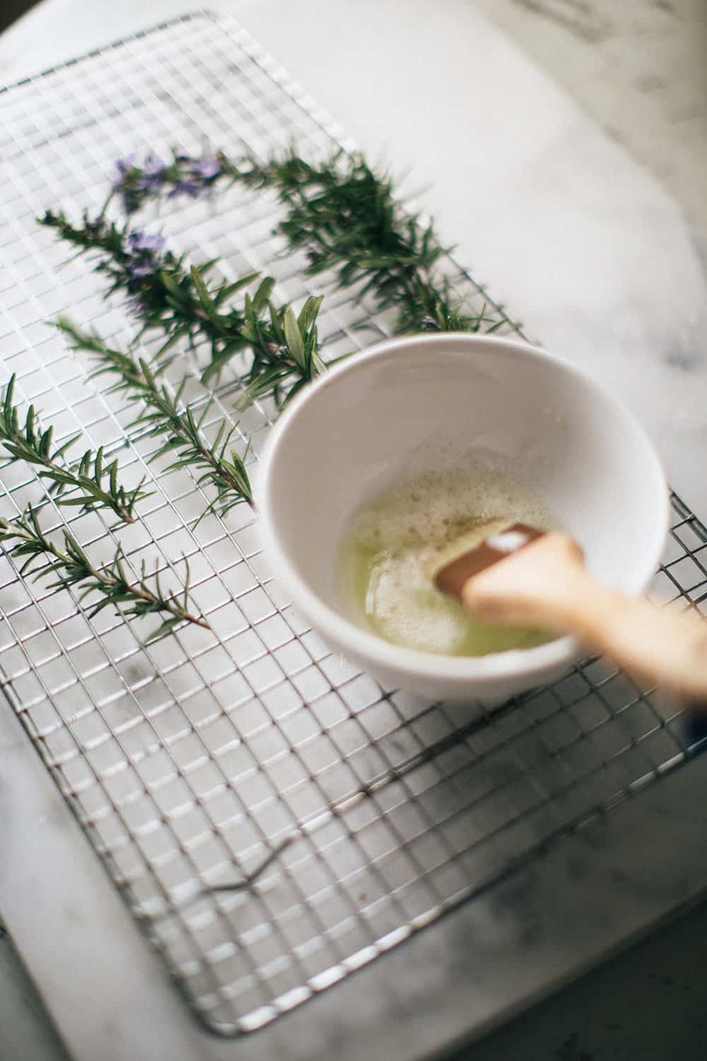 Sugared rosemary on cooling rack.