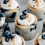 Petit fours with blueberries and cream cheese frosting.