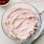 Raspberry french buttercream in a bowl.