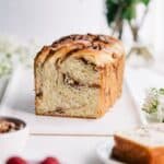 Loaf of raspberry pecan babka on a serving tray.