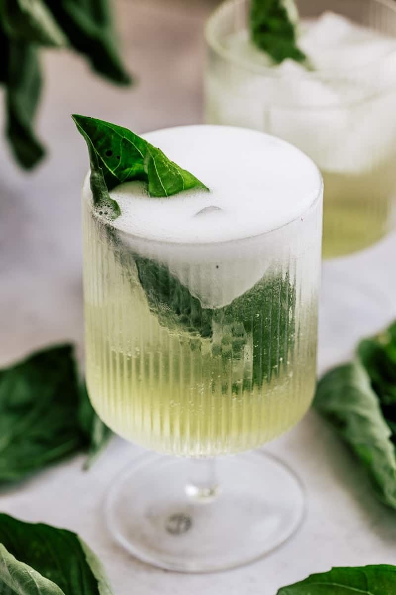 Basil Spritz Cocktail with a fresh basil leaf.