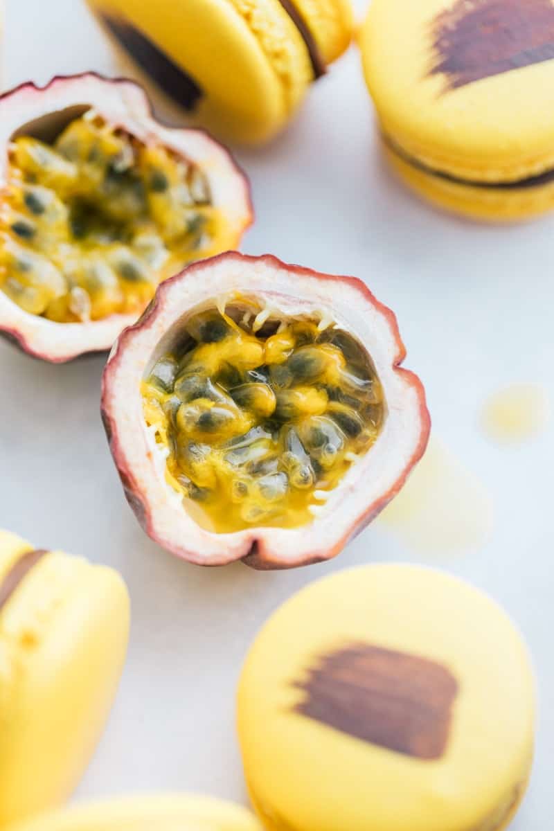 Passion fruit surrounded by macarons.