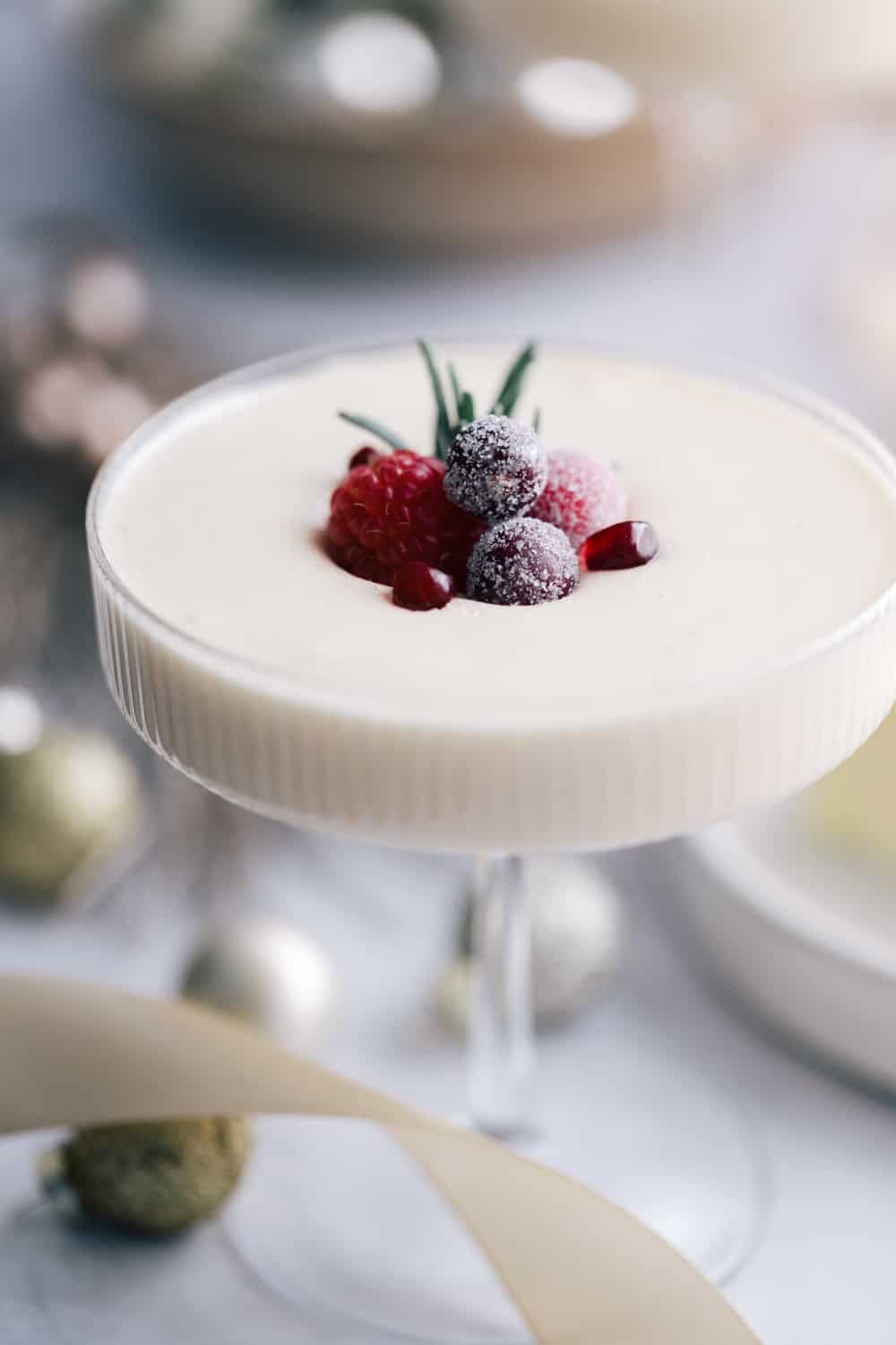 Easy white chocolate mousse recipe closeup with sugared berries on top.
