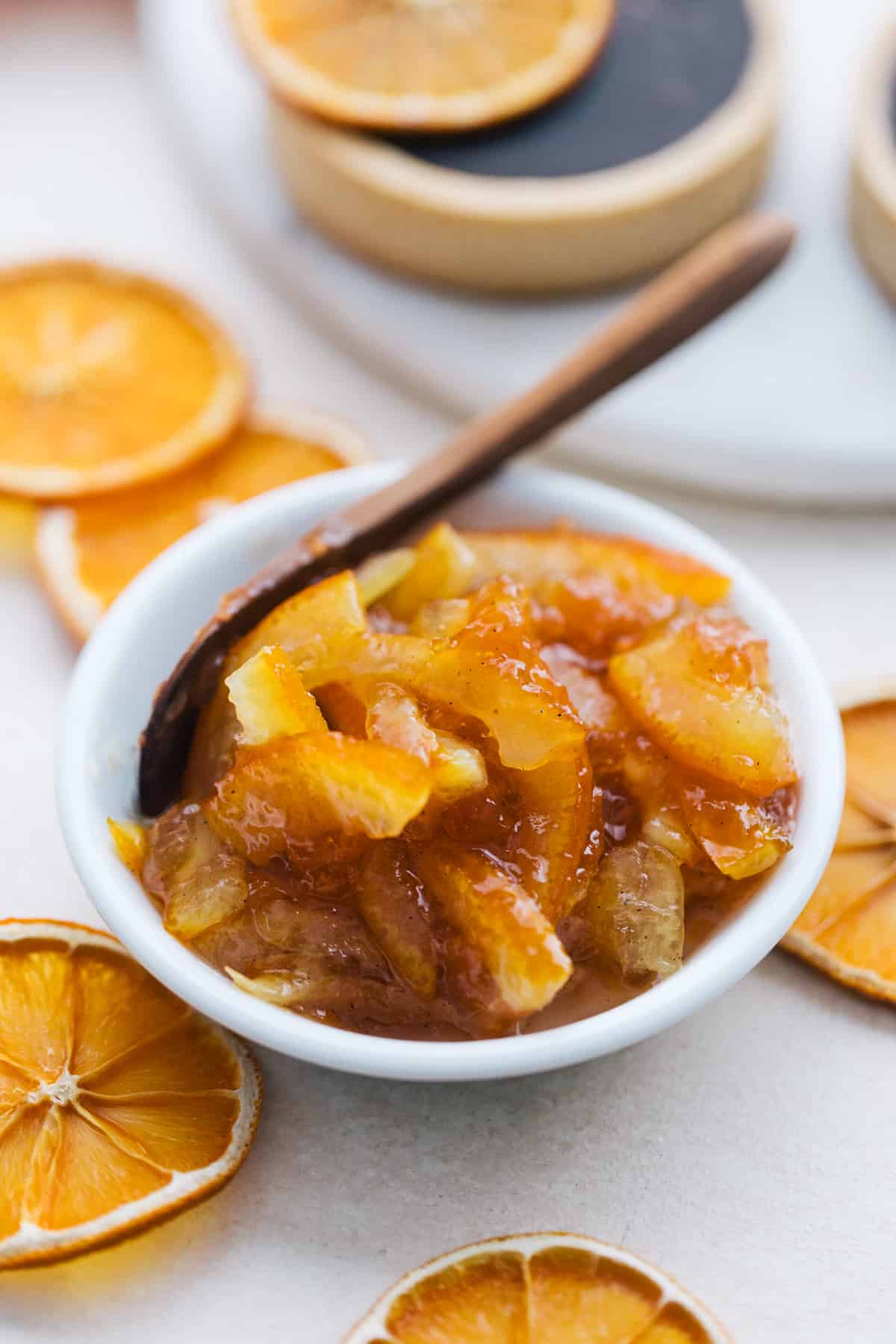 Orange marmelade in a small bowl for orange tarts.