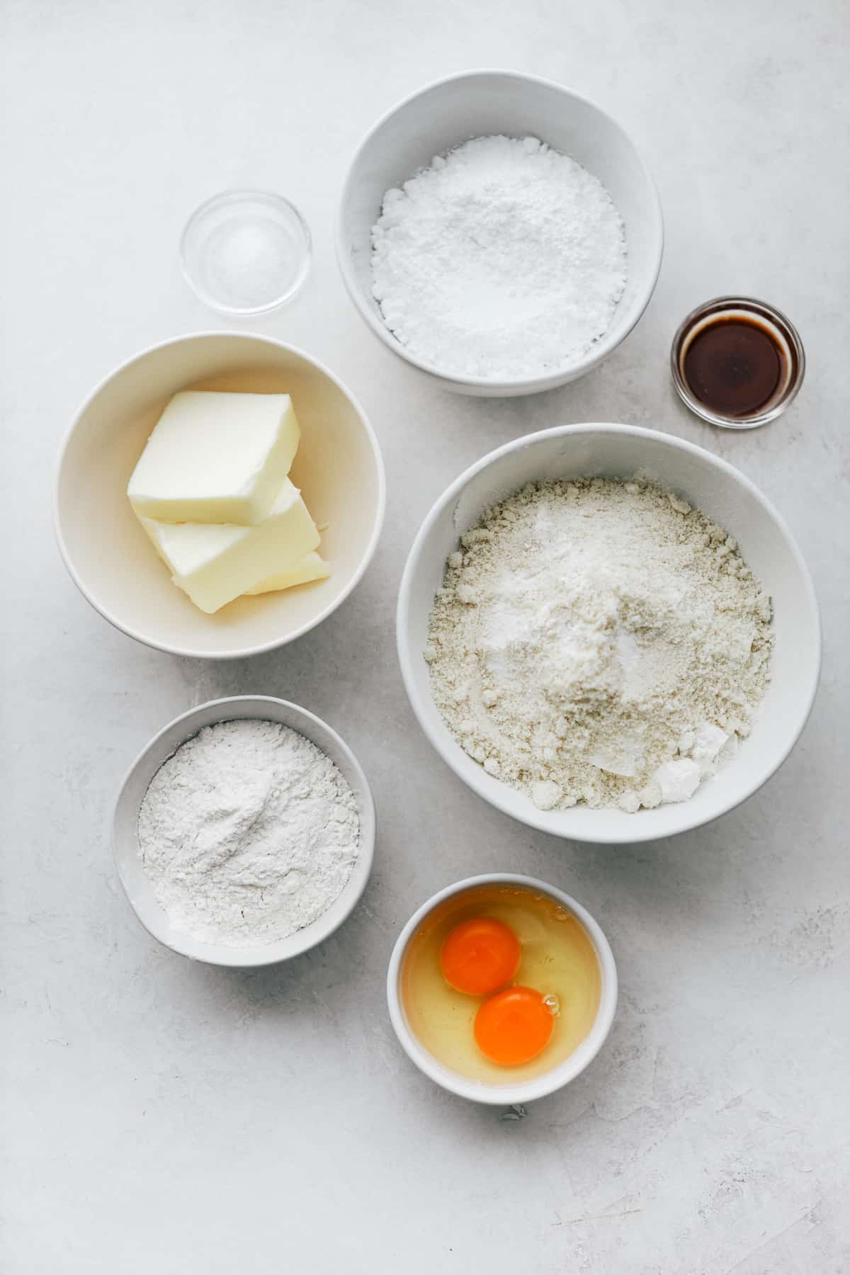 Ingredients needed to make tart dough in small bowls.