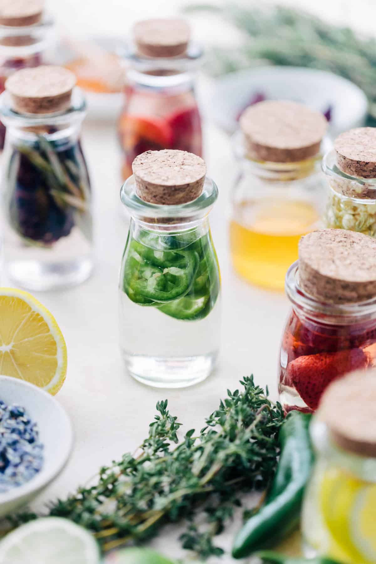 Infused simple syrups in glass jars.
