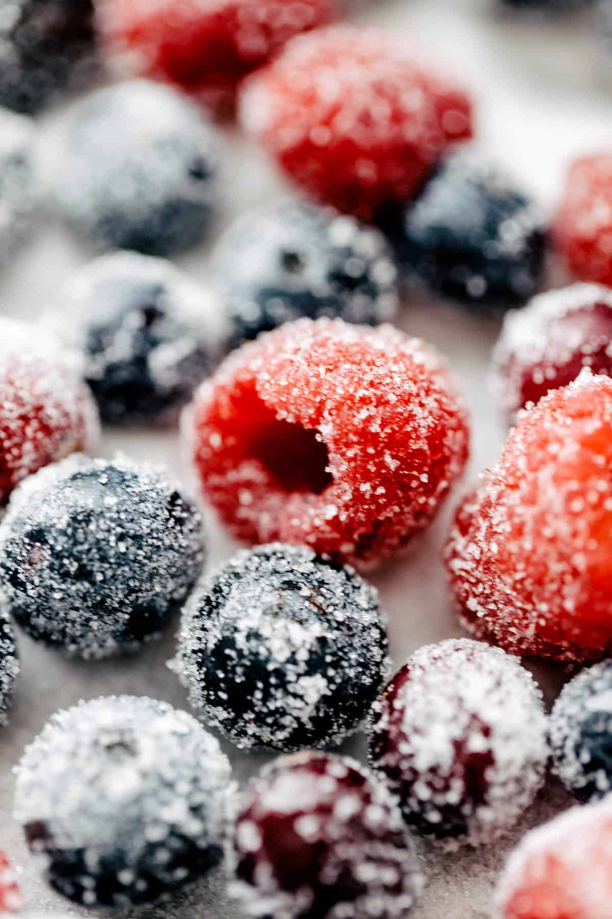 Sugared raspberries, blueberries and cranberries.
