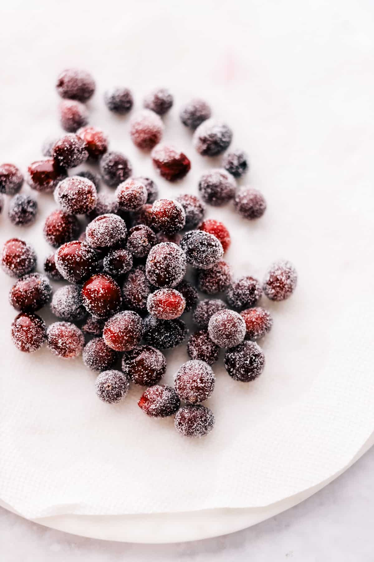 Dried sugared berries on a paper towel drying.