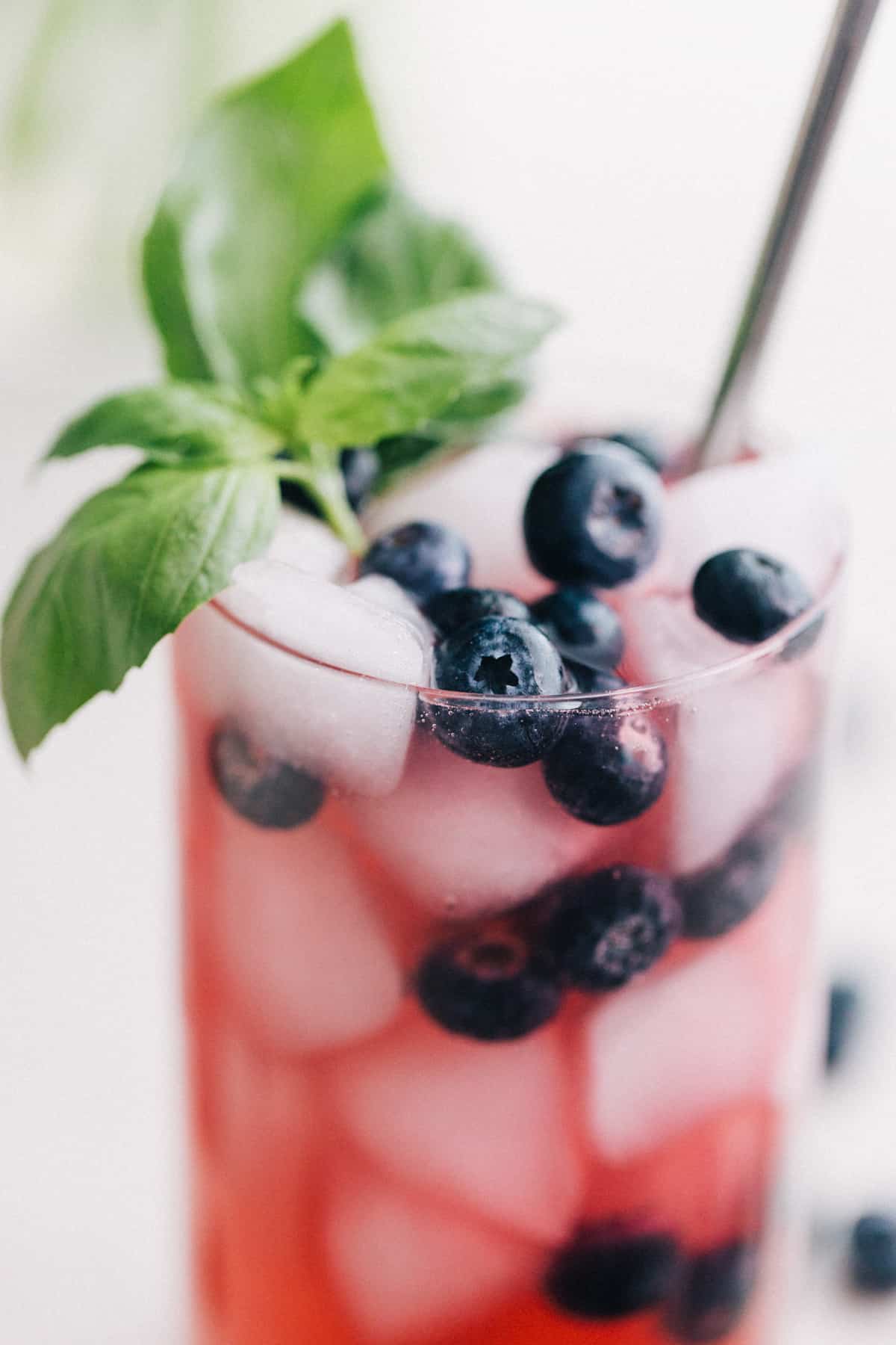 Finished sparkling basil and blueberry mocktail.