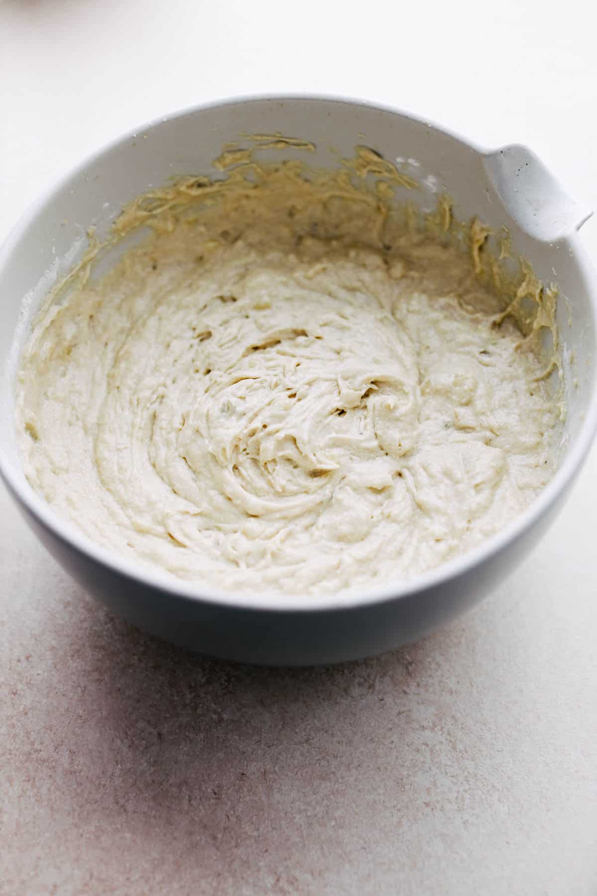 Banana bread batter in a bowl.