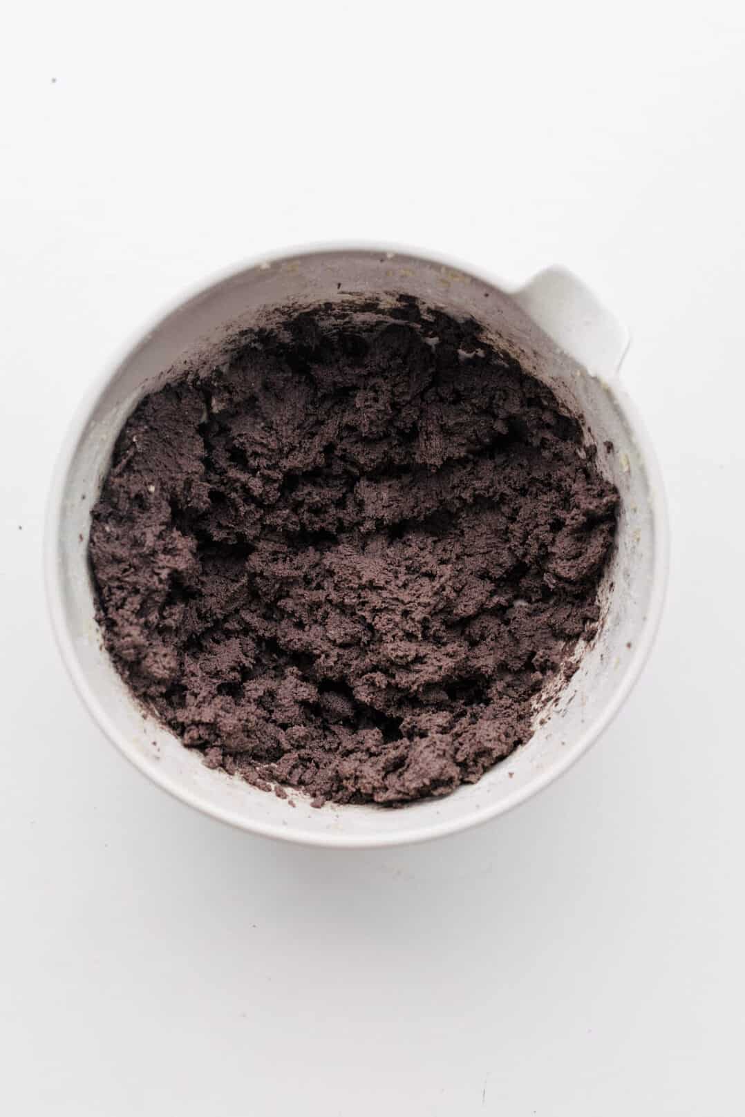 Mixed chocolate cookie dough in a mixing bowl.