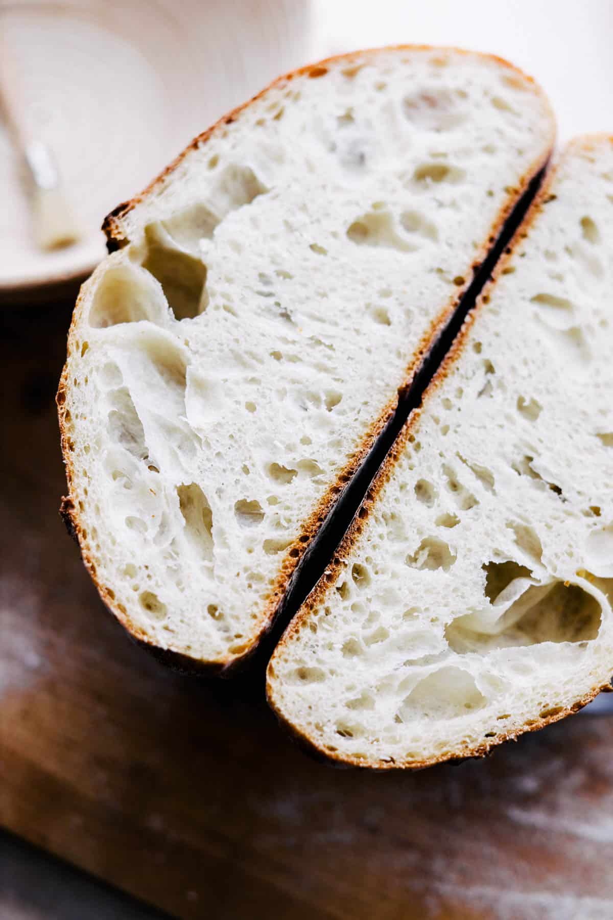 Cut open baked sourdough loaf.