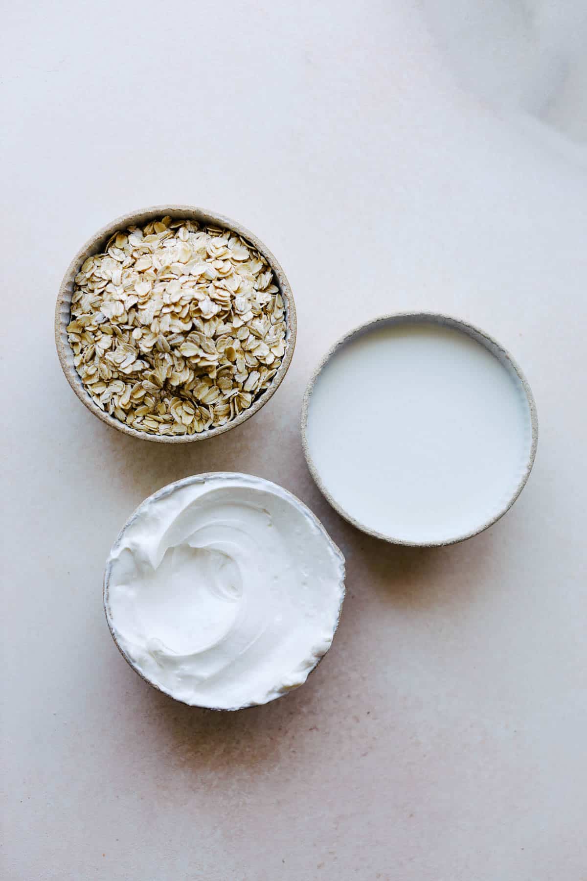 Ingredients in bowls for making overnight oats.