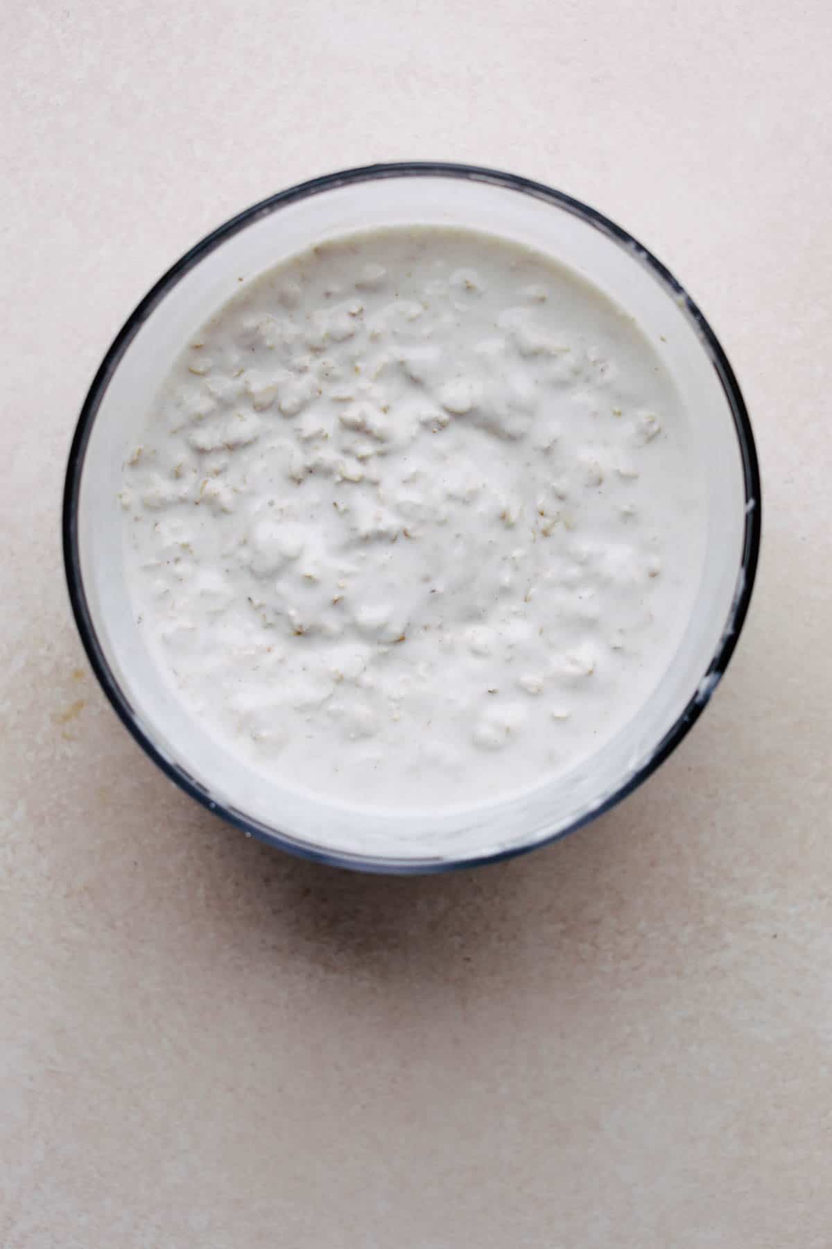 Mixed overnight oats in a large container.