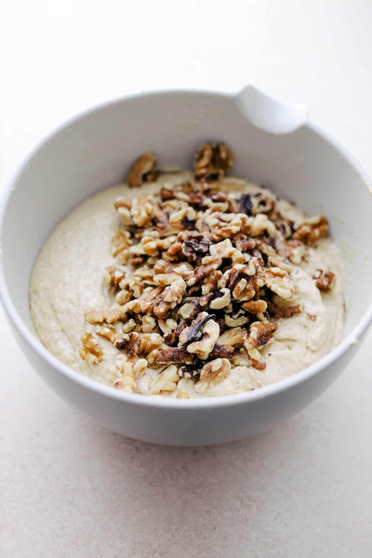 Sourdough Walnut Banana Bread batter in a bowl.