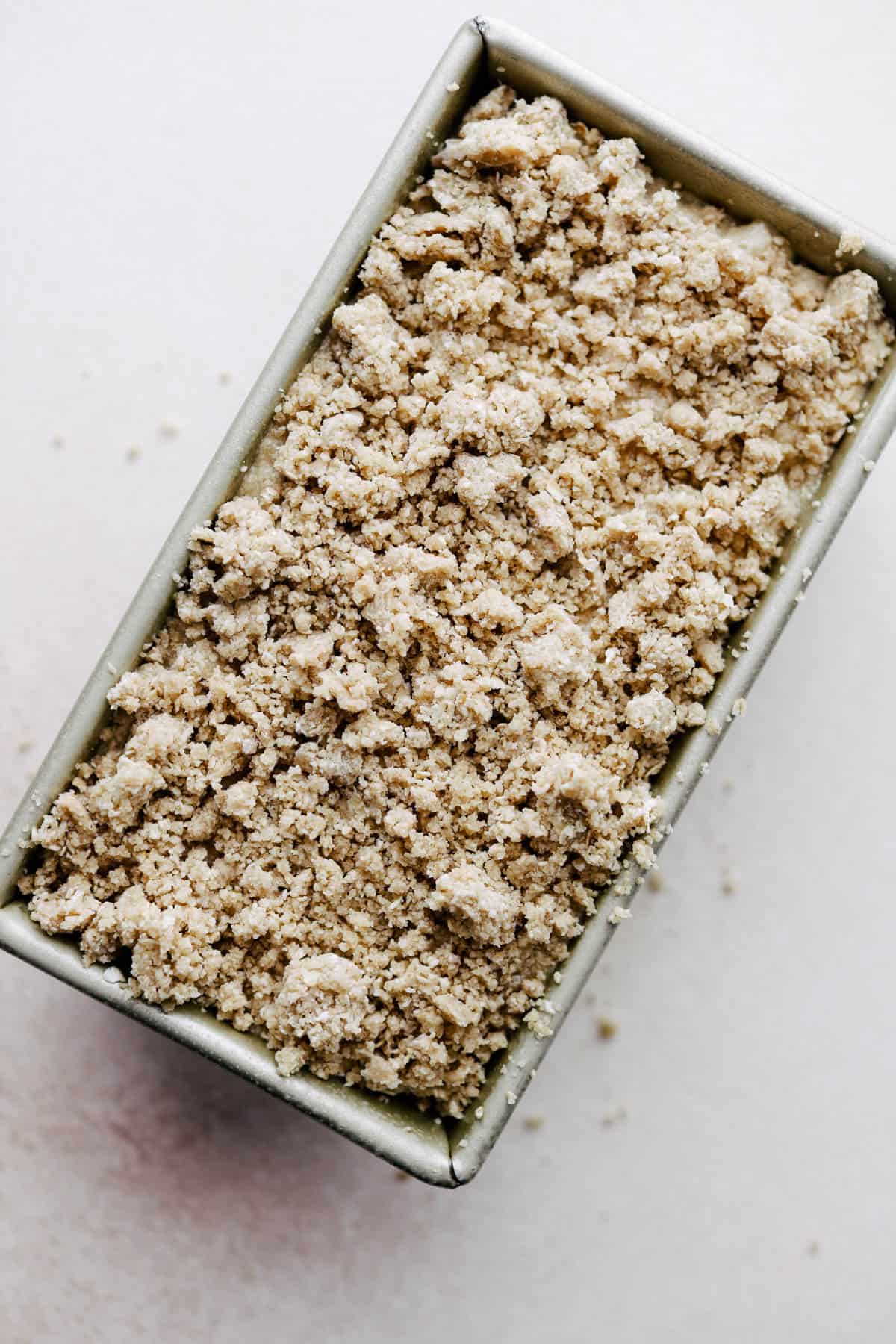 Unbaked banana bread in a loaf pan.