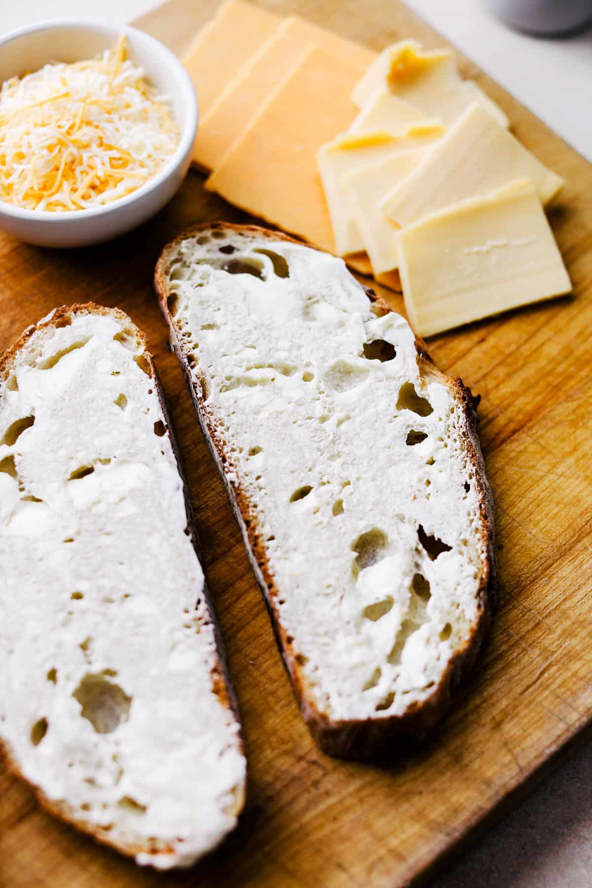 Butter added to sourdough slices.