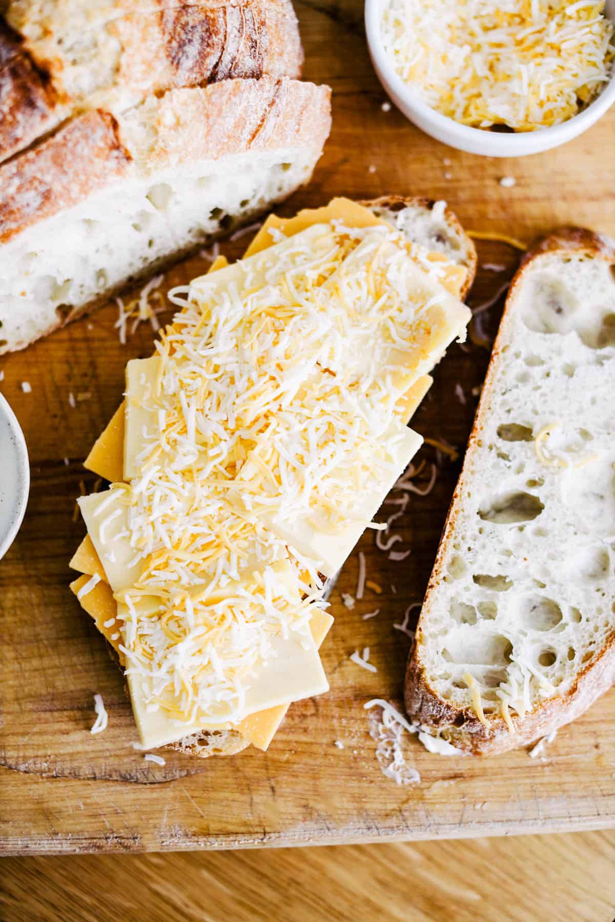 Cheese on top of sourdough slices.