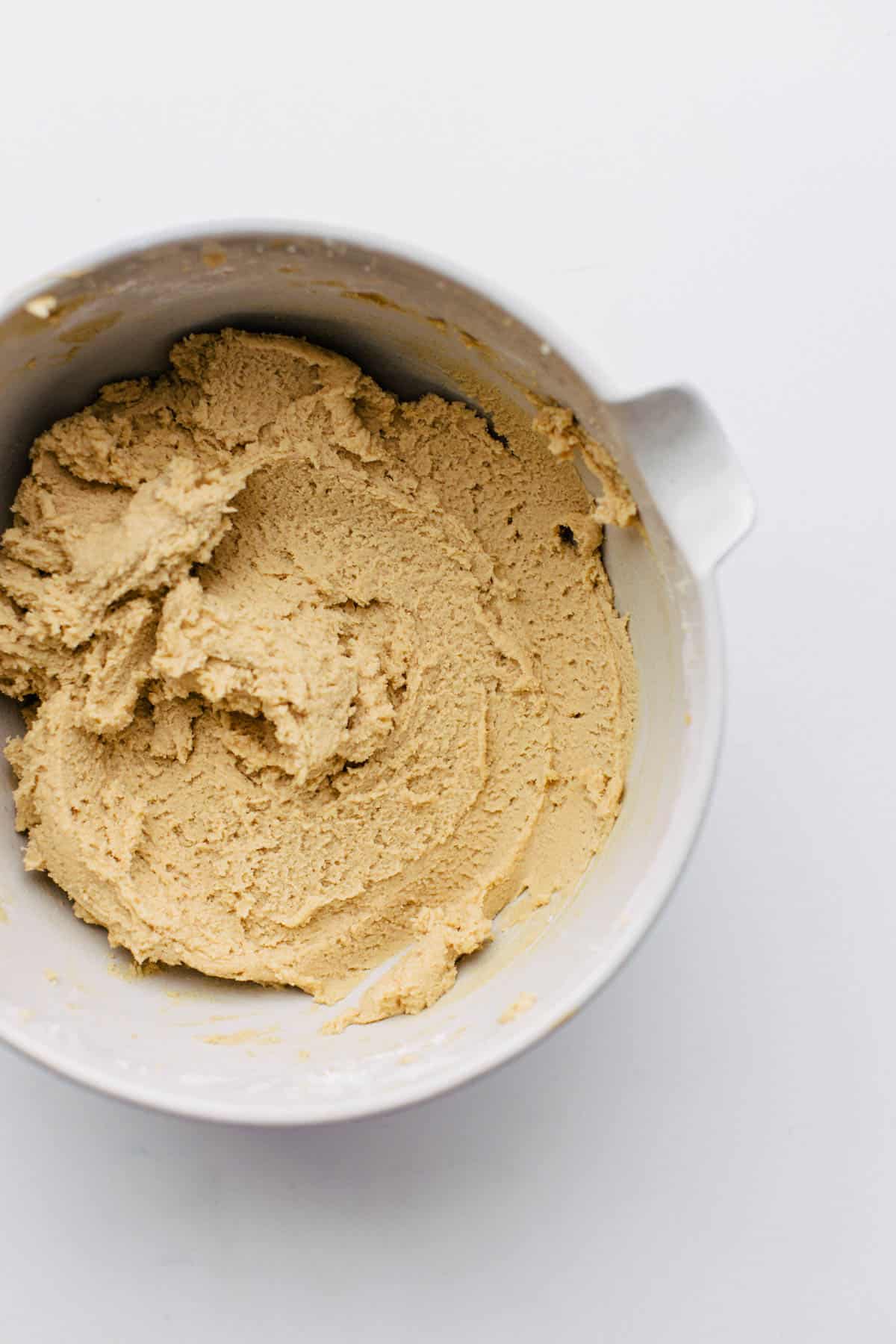 peanut butter cookie dough mixed in a bowl.