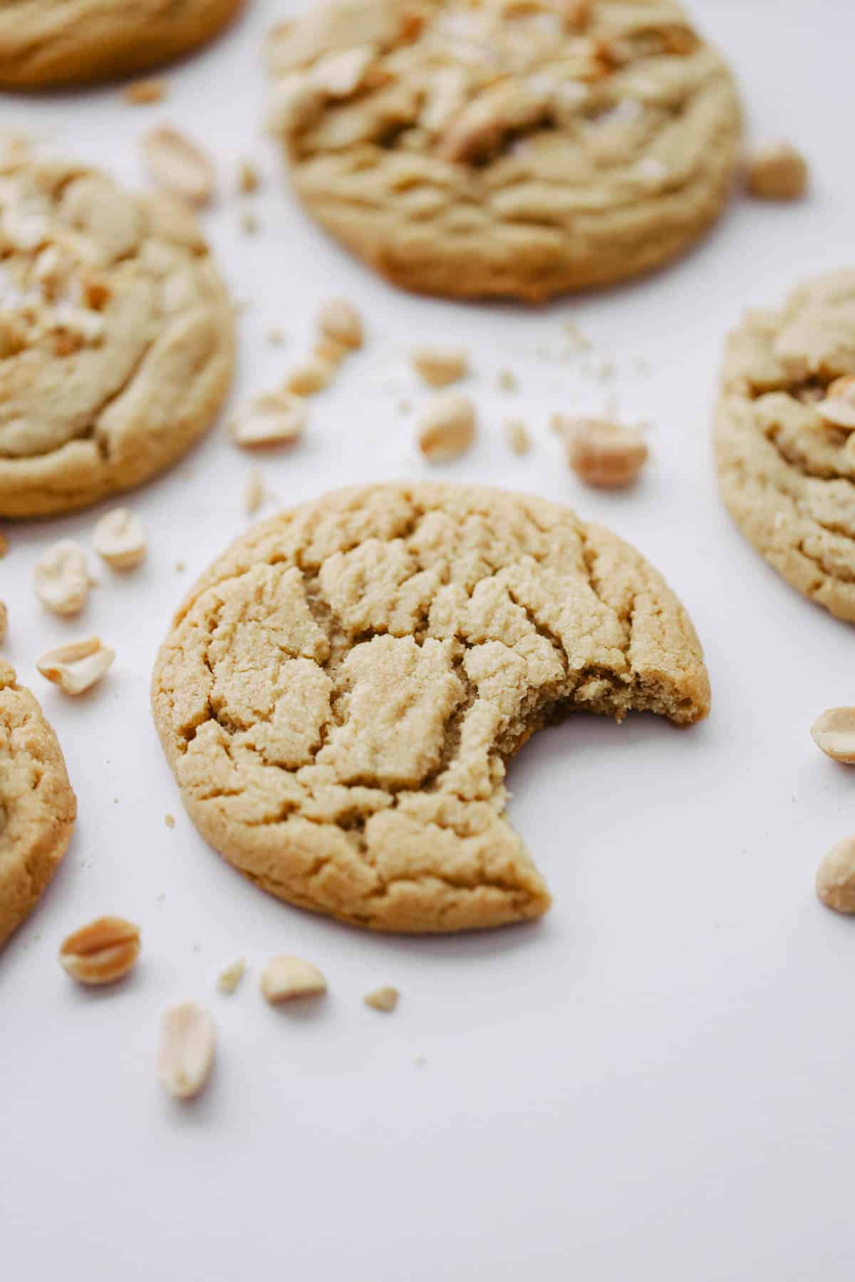 Peanut butter cookie with bite taken out of the side.