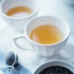 Homemade steeped tea in tea cups.