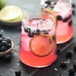 Blueberry margarita garnished with blueberries and salt.