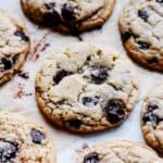 Sourdough discard chocolate chip cokies on parchment paper.