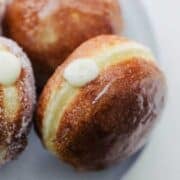 Creme brulee donuts on a plate.