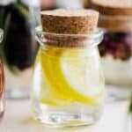 Lemon simple syrup in a small jar.