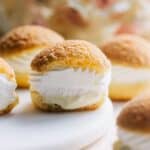 Choux filled with creme diplomat on the counter.