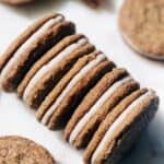 Molasses cookie sandwiches with cream cheese frosting.