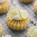 Limoncello mini bundt cakes with a slice of lemon on top.