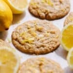 Lemon white chocolate chip cookies on parchment.