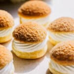 Choux à la Crème on a serving plate in the kitchen.