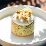 Mini banana cakes on a plate with coconut and granola.