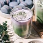 Matcha lavender latte on the counter with macarons.