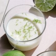 Lime Posset in small cups on a cutting board.