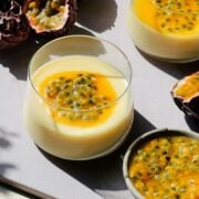 Passion Fruit Posset in small cups on a cutting board.