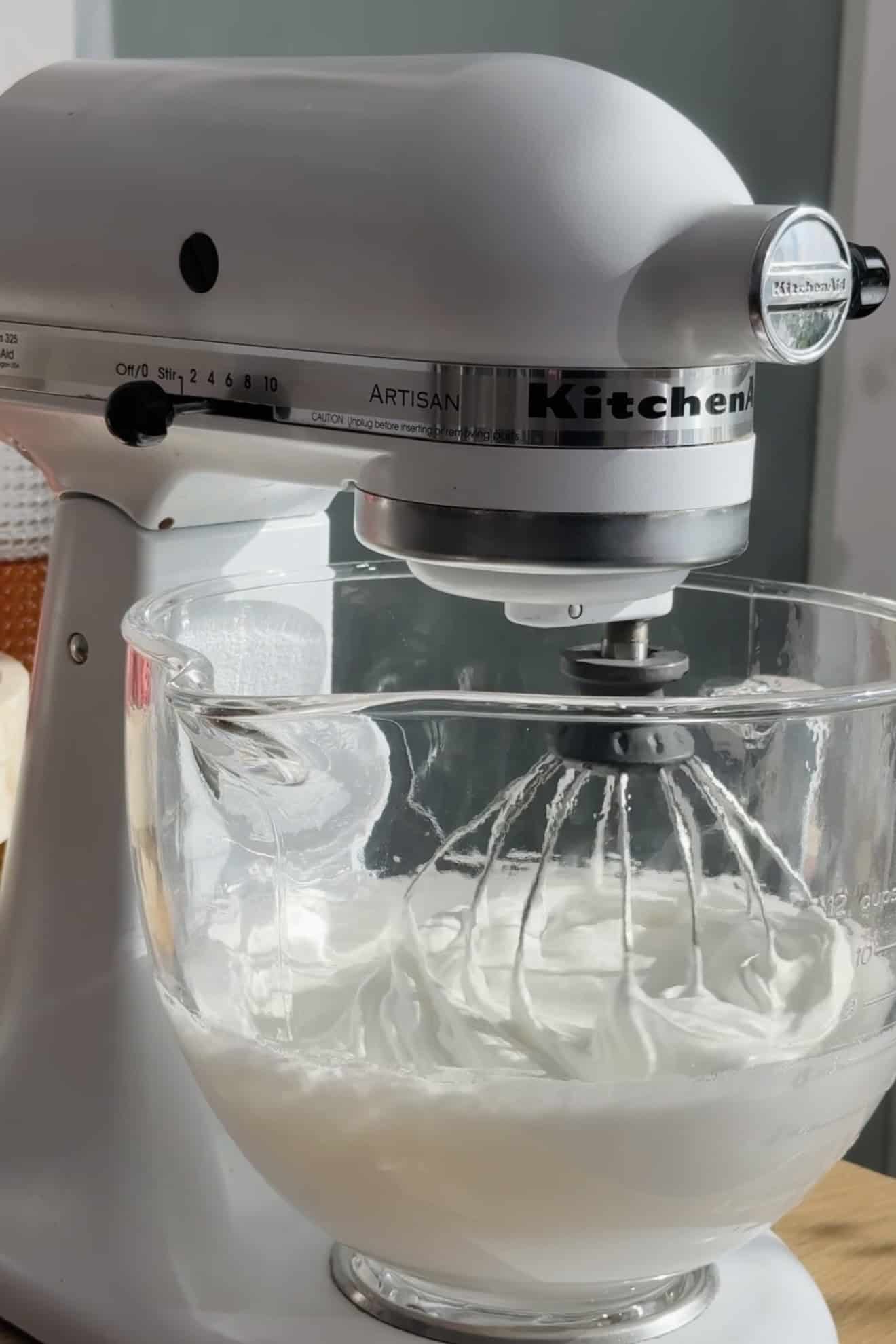 Mixing pavlova merigue together.