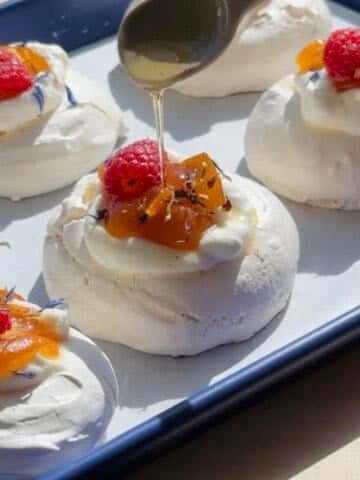 Candied Kumquat Pavlova Nest on a baking sheet.